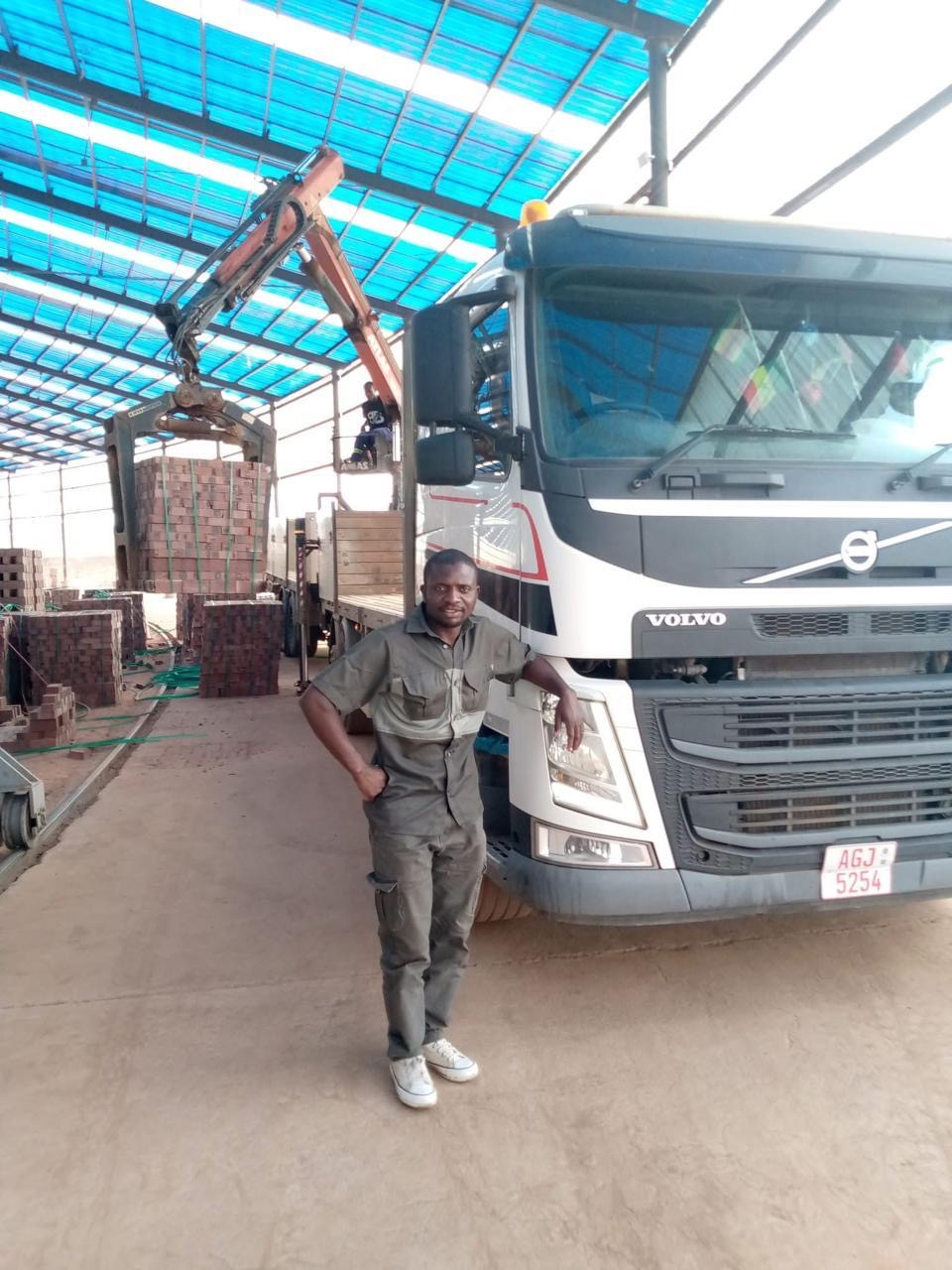 Hexham Express driver with a grab truck at a brick yard